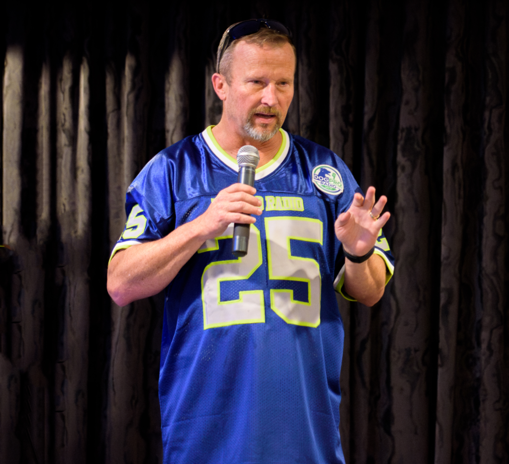 Jason speaking into microphone